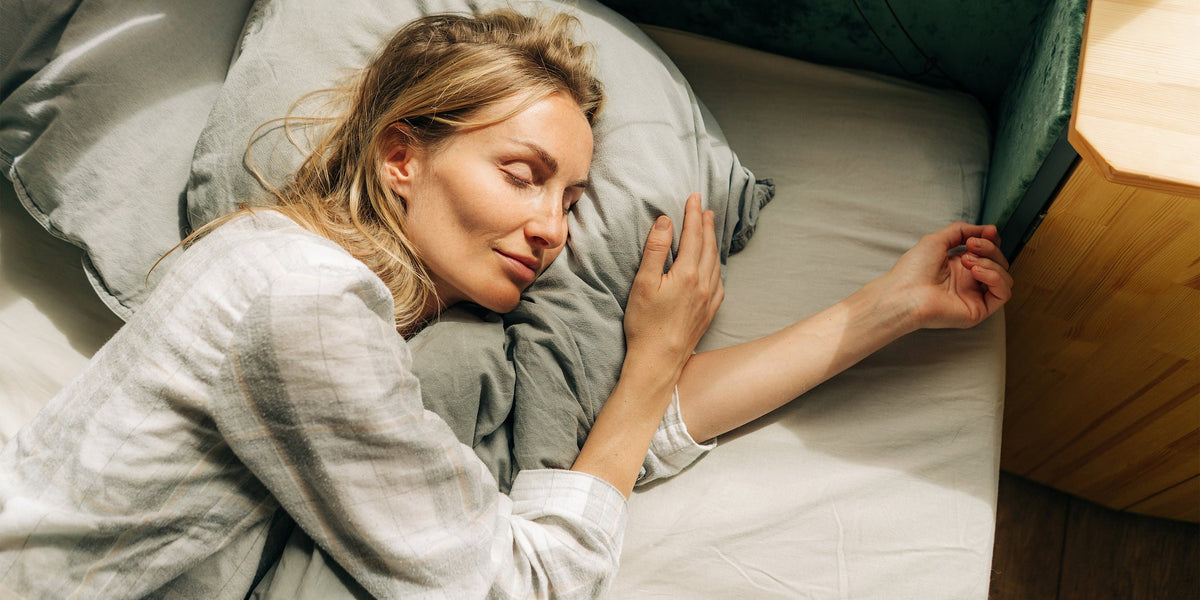 Woman sleeping in a bed