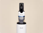 Close-up of Levoit AERO™ cordless vacuum handle and dustbin docked on the auto-empty station.