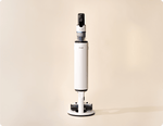Levoit AERO™ cordless vacuum standing upright on its white docking station.
